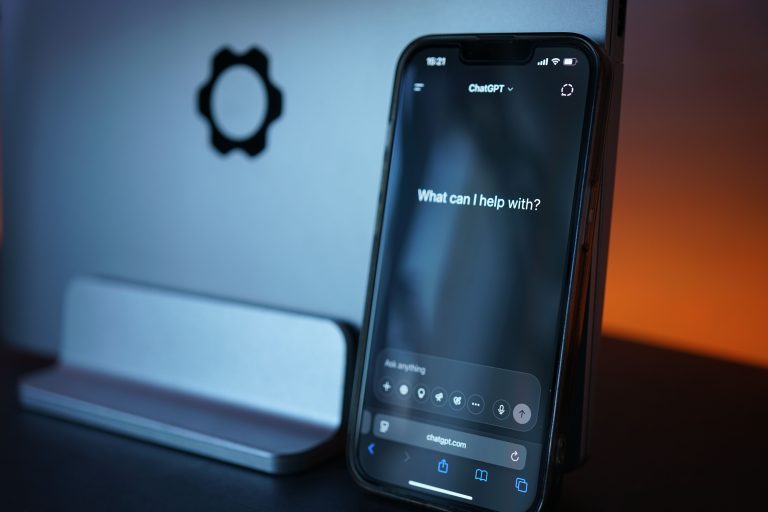 Close-up of a smartphone with AI chat interface, showcasing advanced technology in a sleek design